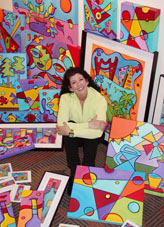 Sonya Paz surrounded by her art in Santa Clara Studio