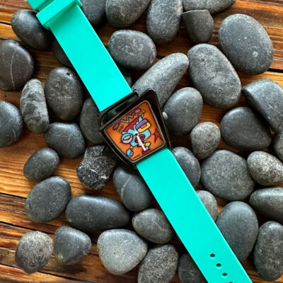 NEW - Tuning into Reality Wristwear with Teal Band!